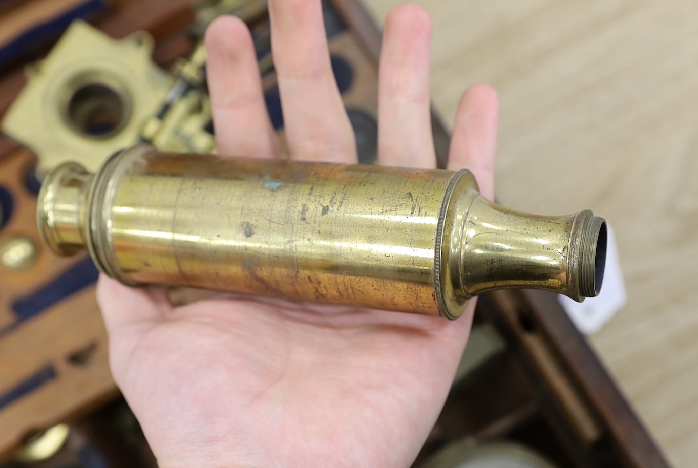 A 19th century cased brass monocular microscope